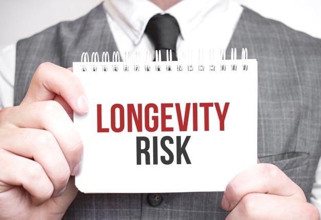businessman with notebook with text longevity risk businessman with notebook with text longevity risk